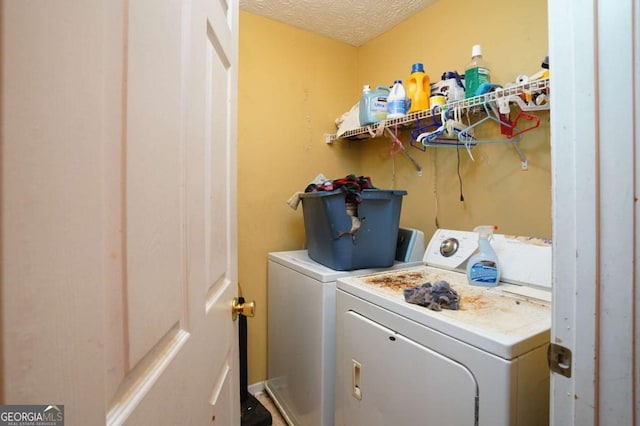 860 Sweet Mill Ln, Lawrenceville, GA 30045 - washroom with independent washer and dryer and a textured ceiling