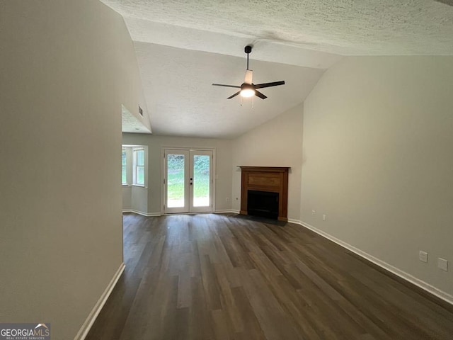 60 Doe Run Dr, Sharpsburg, GA 30277 - unfurnished living room with ceiling fan, a textured ceiling, dark wood-style floors, a fireplace, and high vaulted ceiling