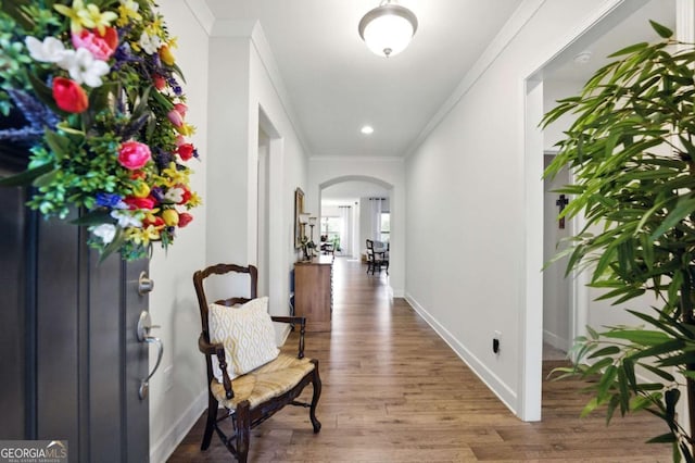 5744 Cypress Bluff Ln, Hoschton, GA 30548 - entryway featuring arched walkways, ornamental molding, wood finished floors, and recessed lighting