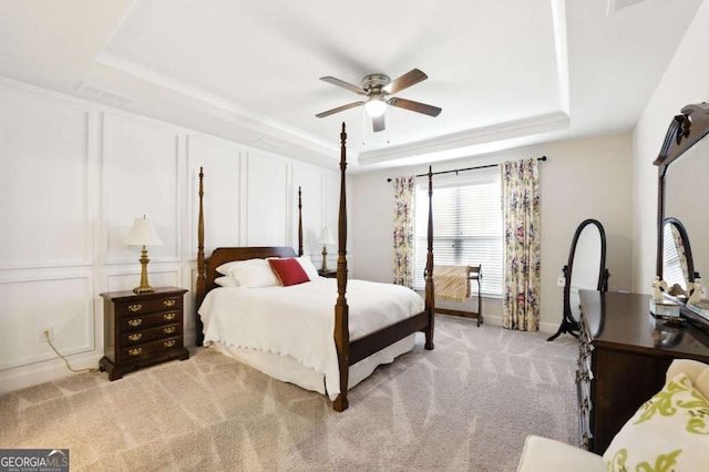5744 Cypress Bluff Ln, Hoschton, GA 30548 - bedroom featuring a raised ceiling, light carpet, and ceiling fan