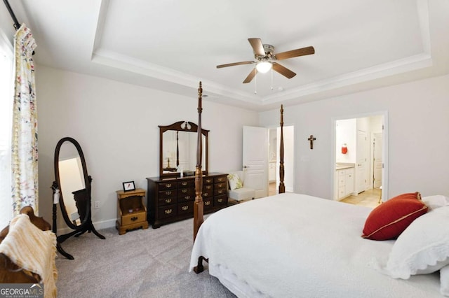 5744 Cypress Bluff Ln, Hoschton, GA 30548 - bedroom featuring a raised ceiling, light carpet, connected bathroom, crown molding, and ceiling fan