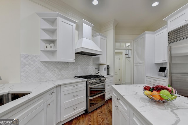 8230 Royal Melbourne Way, Duluth, GA 30097 - kitchen featuring appliances with stainless steel finishes, custom exhaust hood, open shelves, white cabinets, and dark wood-type flooring