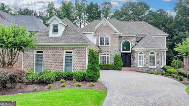 8230 Royal Melbourne Way, Duluth, GA 30097 - view of front of property featuring a shingled roof, brick siding, stone siding, and a front yard