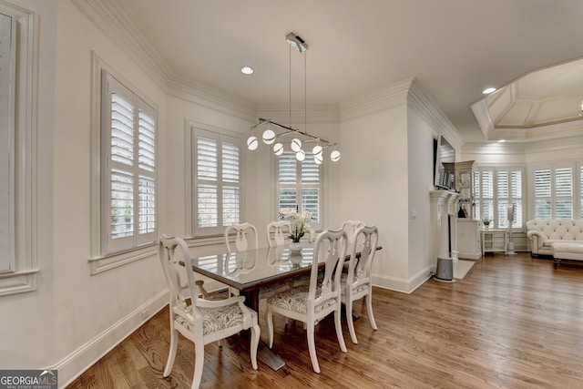 8230 Royal Melbourne Way, Duluth, GA 30097 - dining space with plenty of natural light, light wood finished floors, ornamental molding, recessed lighting, and a fireplace