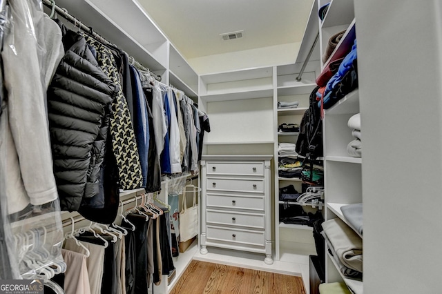 8230 Royal Melbourne Way, Duluth, GA 30097 - walk in closet featuring wood finished floors