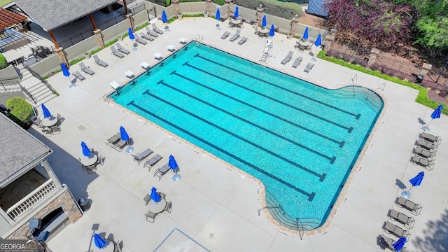 8230 Royal Melbourne Way, Duluth, GA 30097 - community pool featuring a patio area