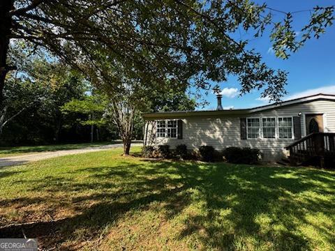3171 Wagnon Mill Rd, Bishop, GA 30621 - view of property exterior with a yard