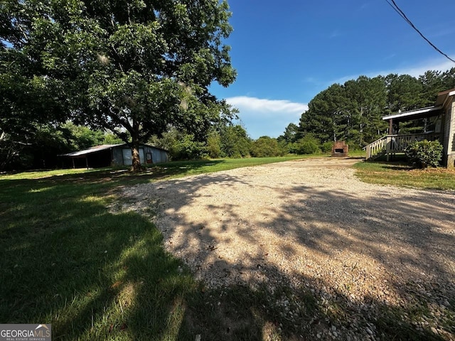 3171 Wagnon Mill Rd, Bishop, GA 30621 - view of green lawn featuring an outbuilding and driveway