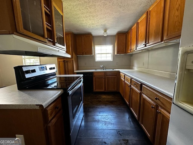 3171 Wagnon Mill Rd, Bishop, GA 30621 - kitchen featuring stainless steel electric range oven, under cabinet range hood, dark wood-style flooring, a textured ceiling, and brown cabinets