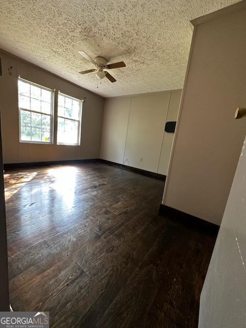 3171 Wagnon Mill Rd, Bishop, GA 30621 - empty room with ceiling fan, a textured ceiling, and dark wood-type flooring