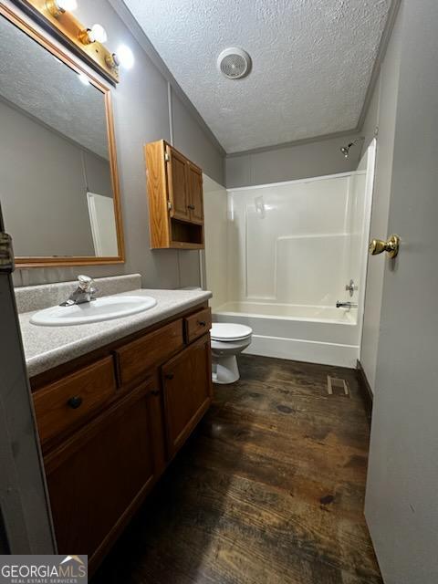 3171 Wagnon Mill Rd, Bishop, GA 30621 - full bathroom with a textured ceiling, wood finished floors, vanity, and shower / bath combination