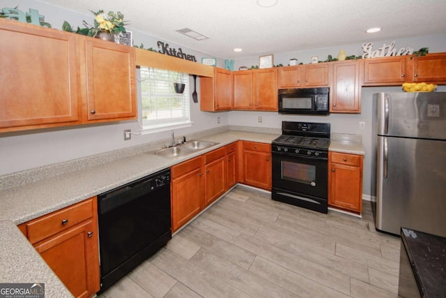 1964 Cutters Mill Way, Lithonia, GA 30058 - kitchen with black appliances, light countertops, light wood finished floors, a textured ceiling, and recessed lighting