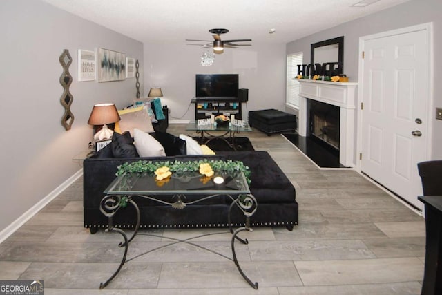 1964 Cutters Mill Way, Lithonia, GA 30058 - living room featuring ceiling fan, a fireplace, and wood finished floors