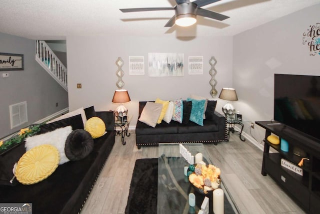 1964 Cutters Mill Way, Lithonia, GA 30058 - living room with a ceiling fan, stairs, and wood finished floors