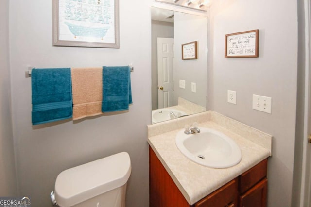 1964 Cutters Mill Way, Lithonia, GA 30058 - half bathroom featuring vanity and toilet
