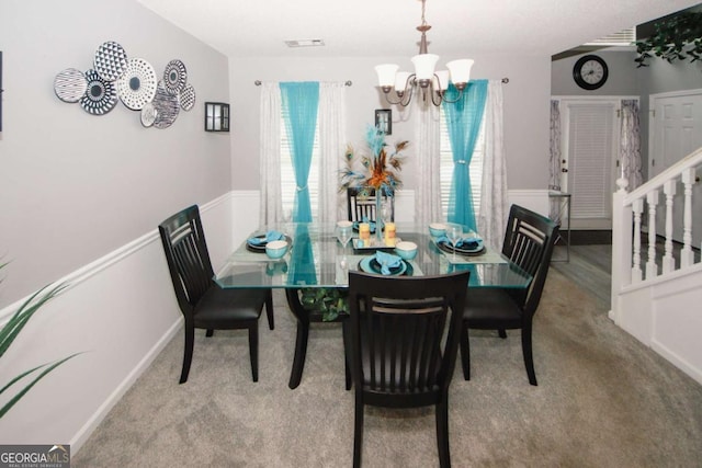 1964 Cutters Mill Way, Lithonia, GA 30058 - carpeted dining space featuring a chandelier and stairway