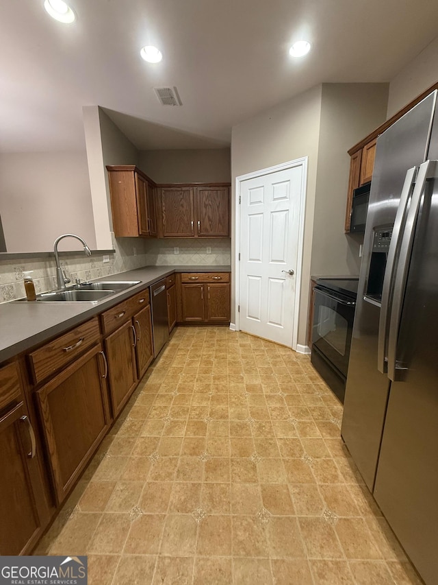1955 Nocturne Dr Unit 3105, Alpharetta, GA 30009 - kitchen featuring black appliances, tasteful backsplash, recessed lighting, and brown cabinets