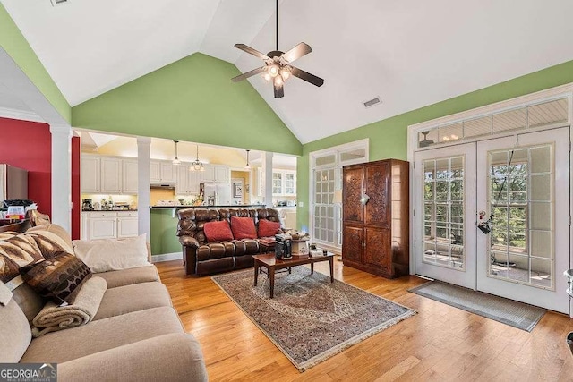 262 Pinnacle Pointe Dr, Rocky Face, GA 30740 - living area with a ceiling fan, high vaulted ceiling, french doors, decorative columns, and light wood-style flooring