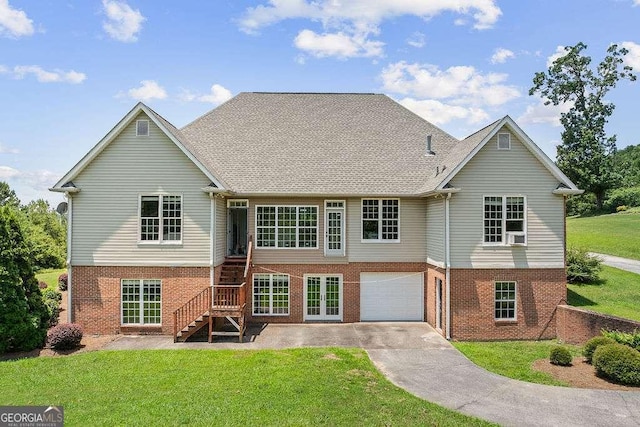 262 Pinnacle Pointe Dr, Rocky Face, GA 30740 - back of property featuring brick siding, a lawn, stairs, and a garage