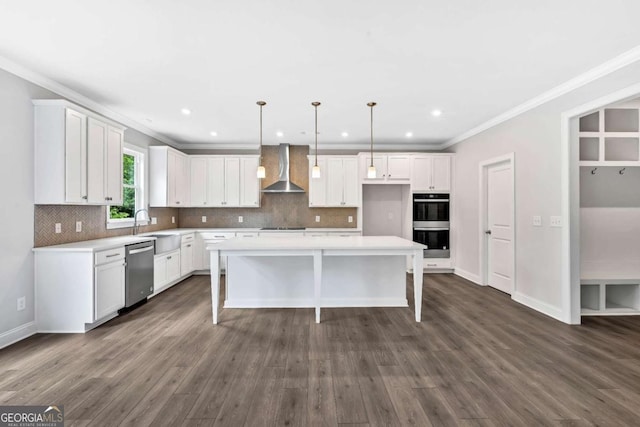 7449 Waterview Cv, Douglasville, GA 30135 - kitchen with black appliances, wall chimney exhaust hood, a kitchen breakfast bar, a center island, and white cabinets