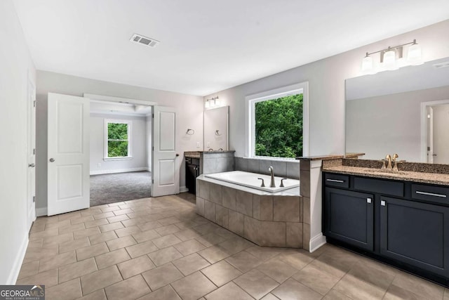 7449 Waterview Cv, Douglasville, GA 30135 - full bath featuring two vanities, a bath, and tile patterned flooring
