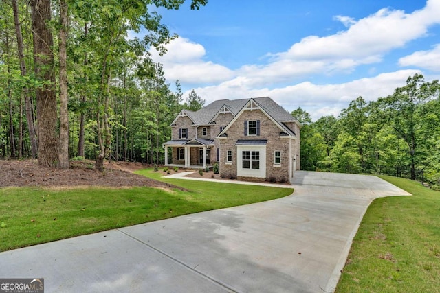 7449 Waterview Cv, Douglasville, GA 30135 - craftsman inspired home with a front lawn, brick siding, and concrete driveway