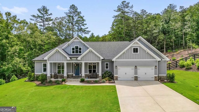 287 Flower Farm Dr, Acworth, GA 30101 - craftsman-style house with board and batten siding, covered porch, concrete driveway, roof with shingles, and an attached garage