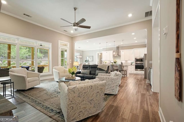 287 Flower Farm Dr, Acworth, GA 30101 - living area featuring a ceiling fan, dark wood-type flooring, recessed lighting, and crown molding