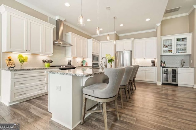 287 Flower Farm Dr, Acworth, GA 30101 - kitchen with wall chimney range hood, beverage cooler, appliances with stainless steel finishes, crown molding, and tasteful backsplash