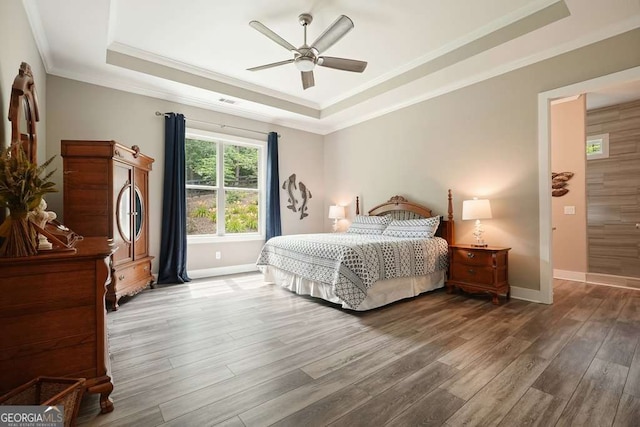 287 Flower Farm Dr, Acworth, GA 30101 - bedroom with a raised ceiling, ornamental molding, wood finished floors, and a ceiling fan
