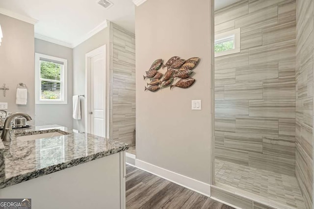 287 Flower Farm Dr, Acworth, GA 30101 - full bathroom with ornamental molding, a walk in shower, vanity, and wood finished floors