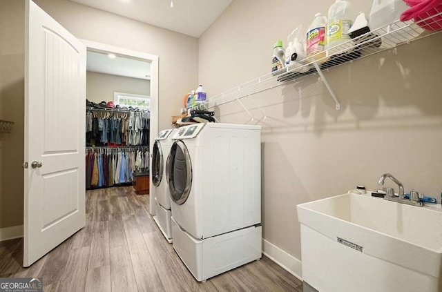 287 Flower Farm Dr, Acworth, GA 30101 - washroom featuring washing machine and dryer and light wood-style floors