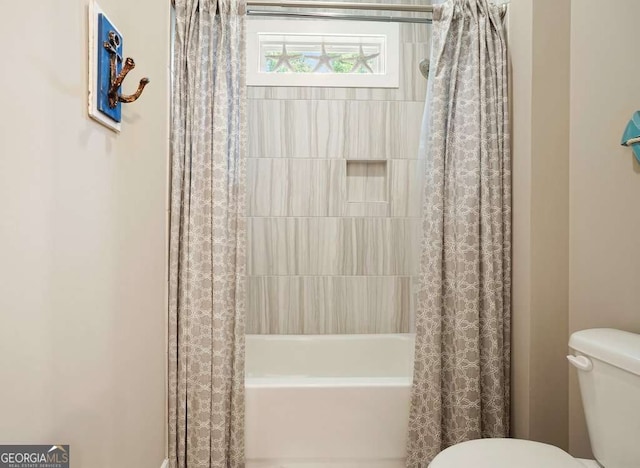 287 Flower Farm Dr, Acworth, GA 30101 - bathroom featuring toilet and shower / bathtub combination with curtain