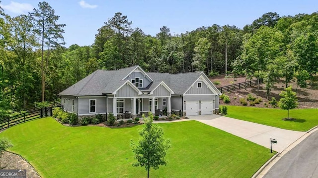 287 Flower Farm Dr, Acworth, GA 30101 - craftsman house featuring board and batten siding, a porch, concrete driveway, a wooded view, and a shingled roof