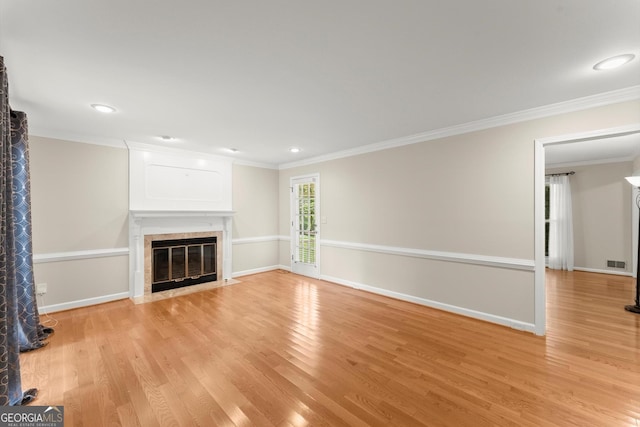 1655 Oak Crest Ct, Marietta, GA 30066 - unfurnished living room with a fireplace with flush hearth, ornamental molding, light wood finished floors, and recessed lighting