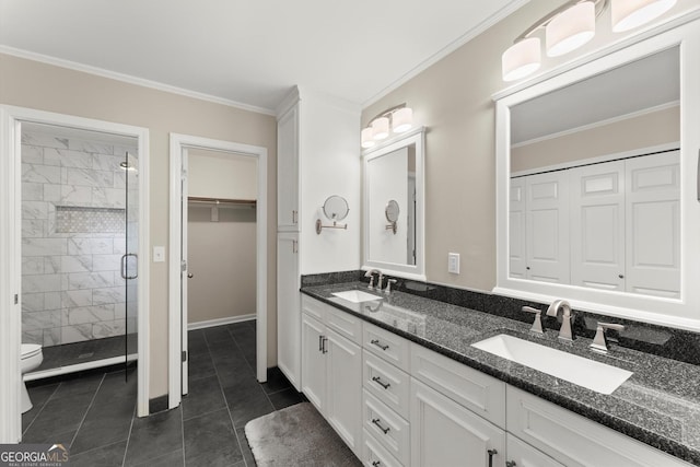 1655 Oak Crest Ct, Marietta, GA 30066 - bathroom with a stall shower, double vanity, crown molding, tile patterned flooring, and a spacious closet