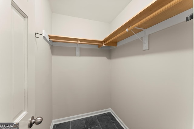 1655 Oak Crest Ct, Marietta, GA 30066 - walk in closet featuring dark tile patterned floors