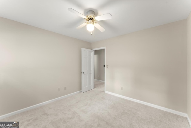 1655 Oak Crest Ct, Marietta, GA 30066 - spare room featuring light carpet and a ceiling fan