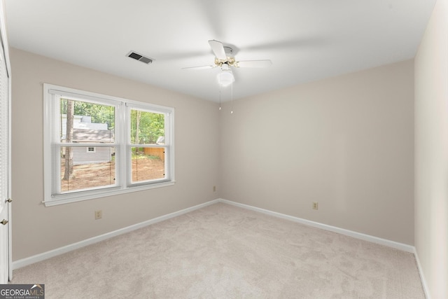 1655 Oak Crest Ct, Marietta, GA 30066 - empty room with light colored carpet and a ceiling fan