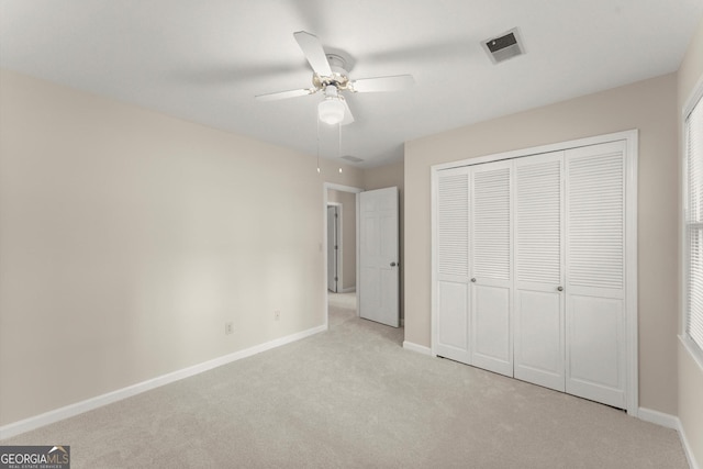 1655 Oak Crest Ct, Marietta, GA 30066 - unfurnished bedroom featuring light carpet, a closet, and a ceiling fan