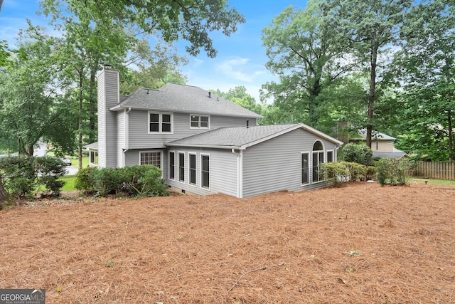 1655 Oak Crest Ct, Marietta, GA 30066 - rear view of property featuring a chimney and a shingled roof