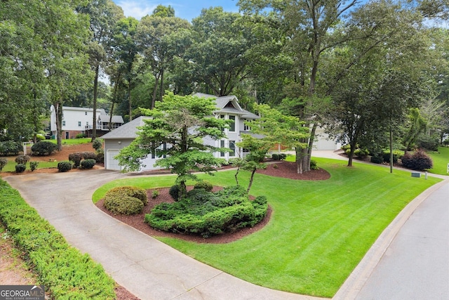 1655 Oak Crest Ct, Marietta, GA 30066 - view of front of home featuring concrete driveway, a garage, and a front yard