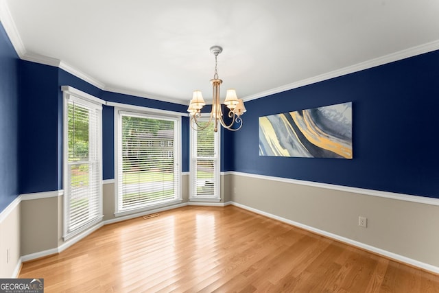 1655 Oak Crest Ct, Marietta, GA 30066 - spare room with a chandelier, wood finished floors, and ornamental molding