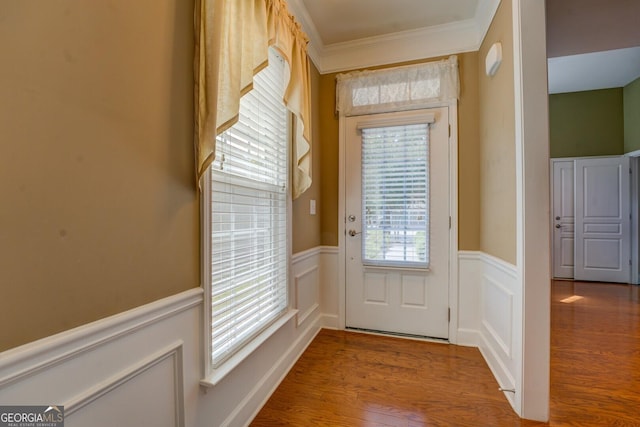 123 Plumleaf Ct, Griffin, GA 30223 - entryway with a wainscoted wall, wood finished floors, crown molding, and a decorative wall