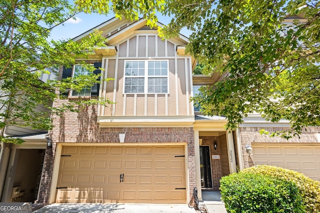 3832 Augustine Pl, Rex, GA 30273 - view of front of house featuring brick siding, board and batten siding, a garage, and driveway