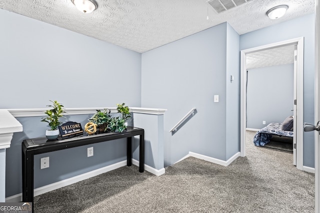 3832 Augustine Pl, Rex, GA 30273 - hallway featuring carpet flooring, an upstairs landing, and a textured ceiling
