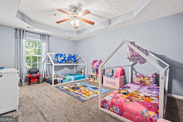 3832 Augustine Pl, Rex, GA 30273 - bedroom with a textured ceiling, carpet flooring, a raised ceiling, and ceiling fan