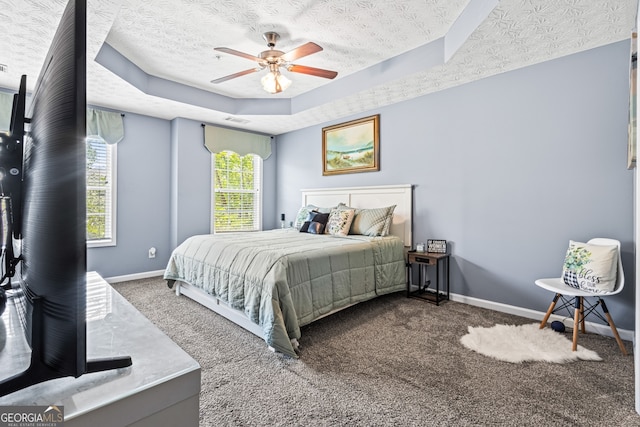3832 Augustine Pl, Rex, GA 30273 - bedroom featuring carpet flooring, a tray ceiling, ceiling fan, and a textured ceiling