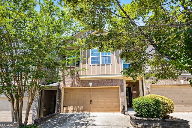 3832 Augustine Pl, Rex, GA 30273 - view of front facade with driveway, brick siding, and an attached garage