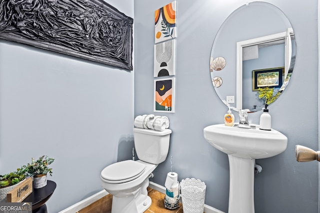 3832 Augustine Pl, Rex, GA 30273 - half bathroom with toilet and wood finished floors